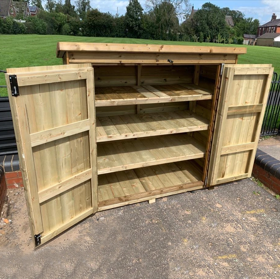 Tool shed with double doors open and three interior shelves